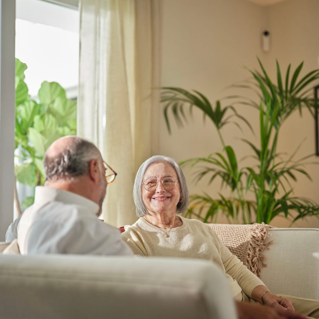 Old couple smiling at each other