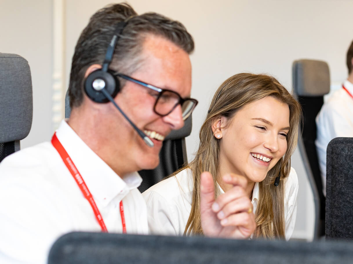 Verisure colleagues working together at computer workstations