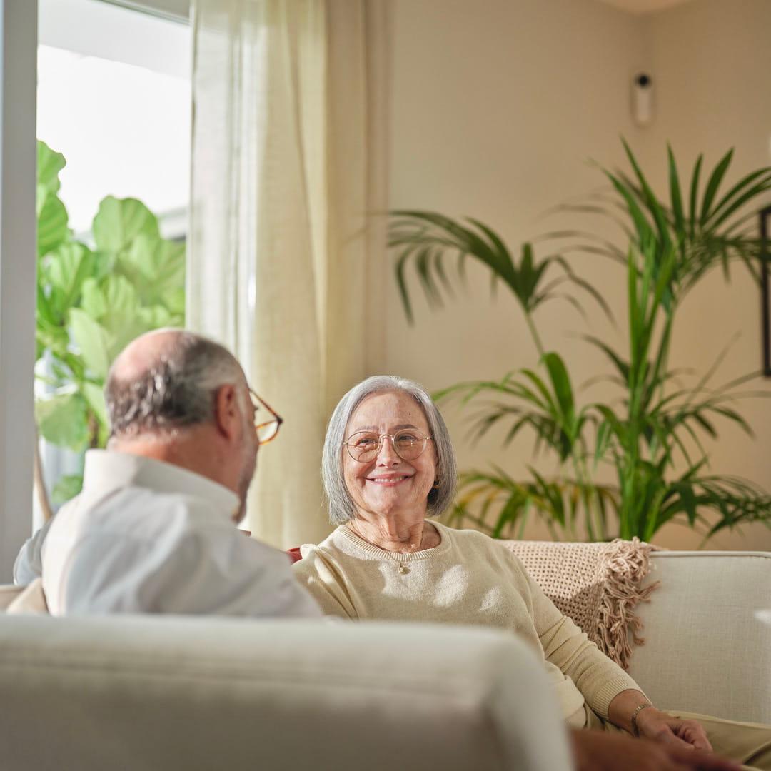 Old couple smiling at each other
